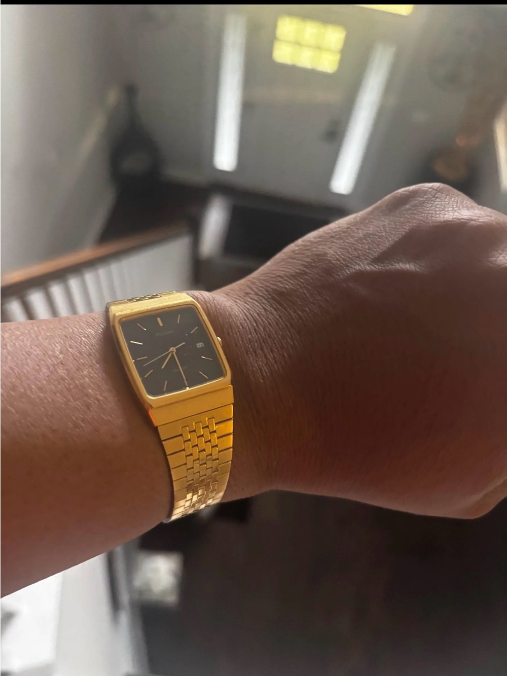 Vintage Pulsar By Seiko Gold Tone Date Watch with a sleek Black Dial
